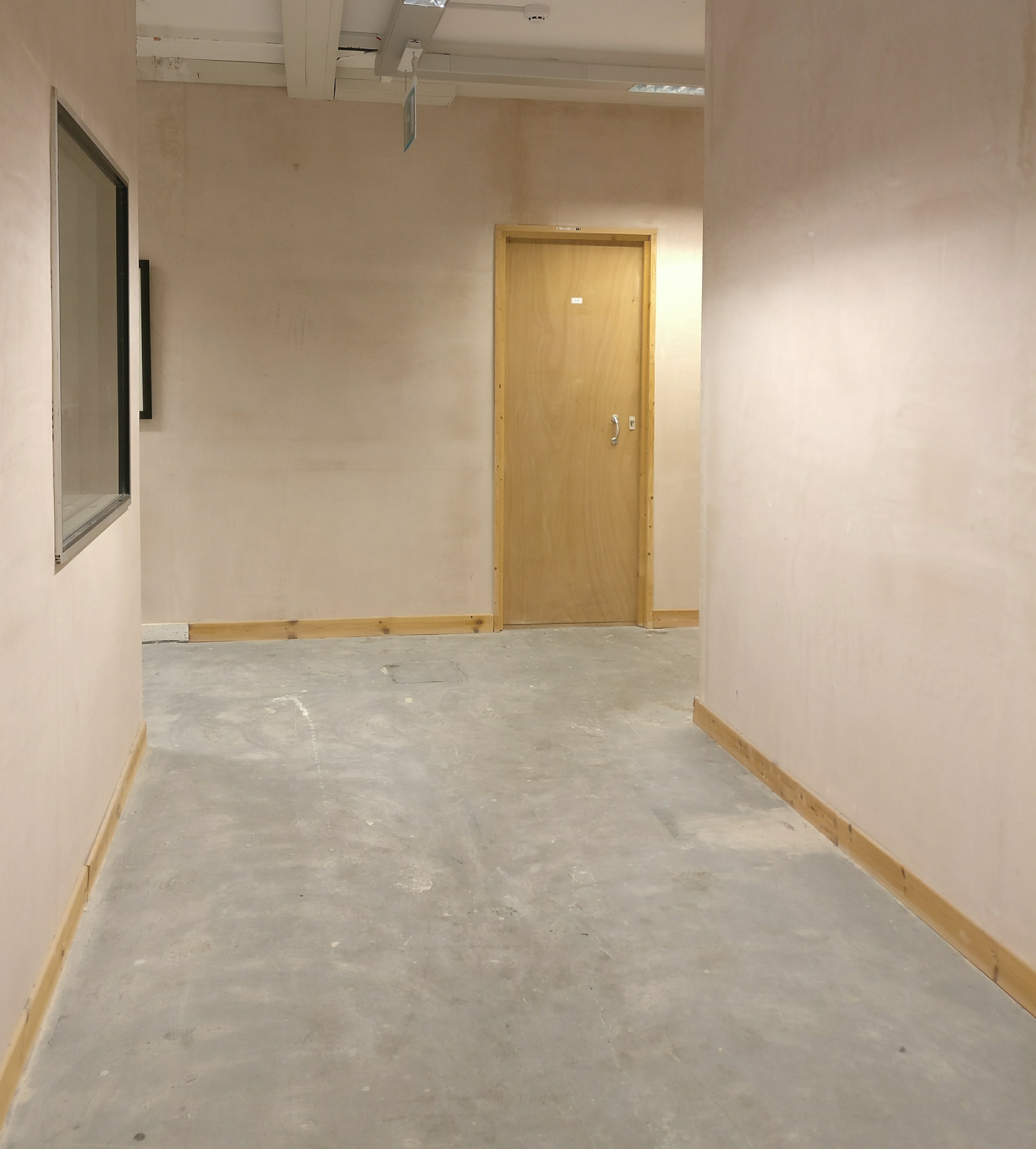 Picture of corridor with door at end