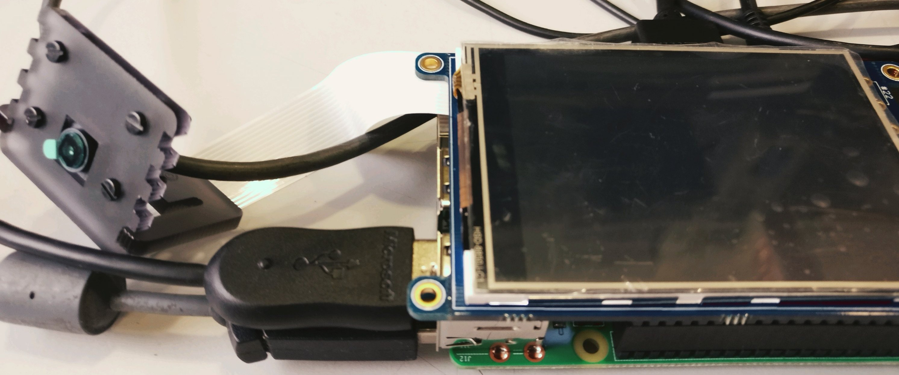 a raspberry pi mini computer, mini screen and pi camera