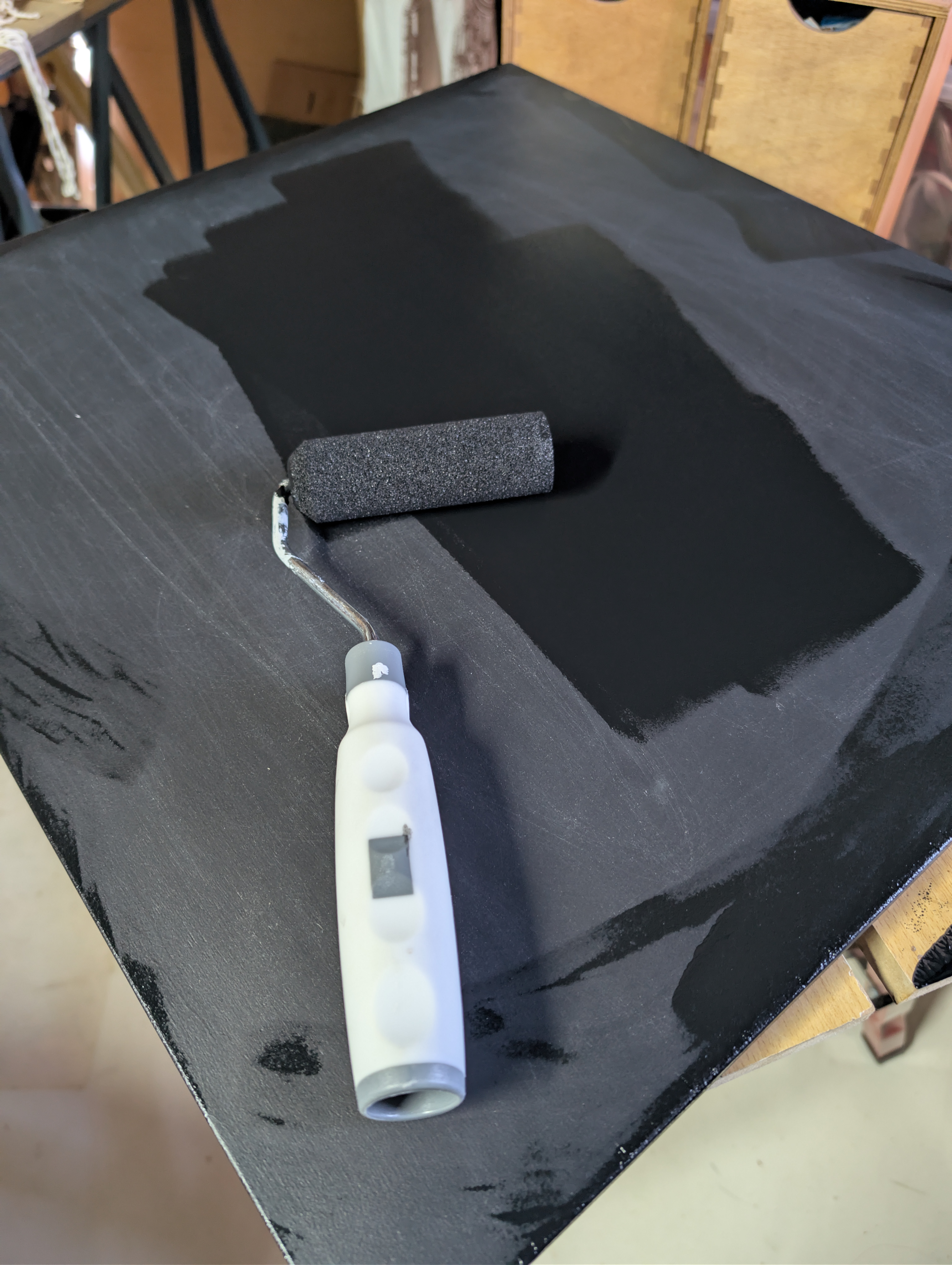 same piece of wood but with black paiont and a small paintroller on it