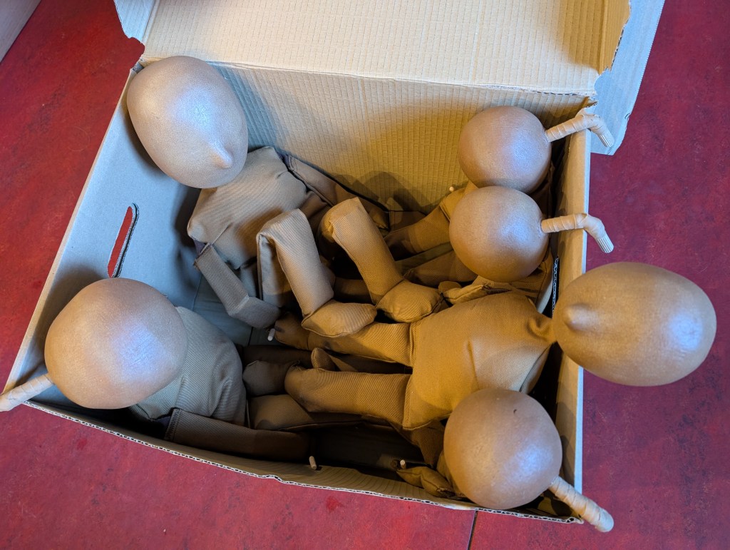 some table top puppets are sitting in a cardboard box
